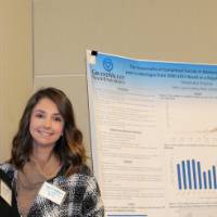 Dr. Molla and a student standing together, smiling